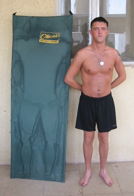 I've heard of people trying to fill others boots but Nev here has taken things a little too far. He poses next to a sunbed as used by Sean the 'God lof love',  to top up his tan, check out the sweat marks! (Sean was too shy to pose in the piccie himself so Nev took his place.)