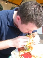 Meanwhile, Neil continues to pile in the food...