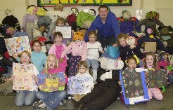 Neil Carter with 'Best Guy' winner Samantha Prye, runners-up Kerry Larkin and Erin Fyson, and all 7 winners of the Lister School Painting competition, which Neil also judged...